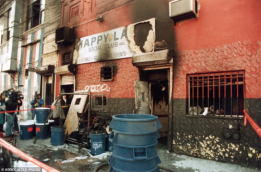 The charred facade of the Happy Land social club in the Bronx section of New York City is pictured in 1990
