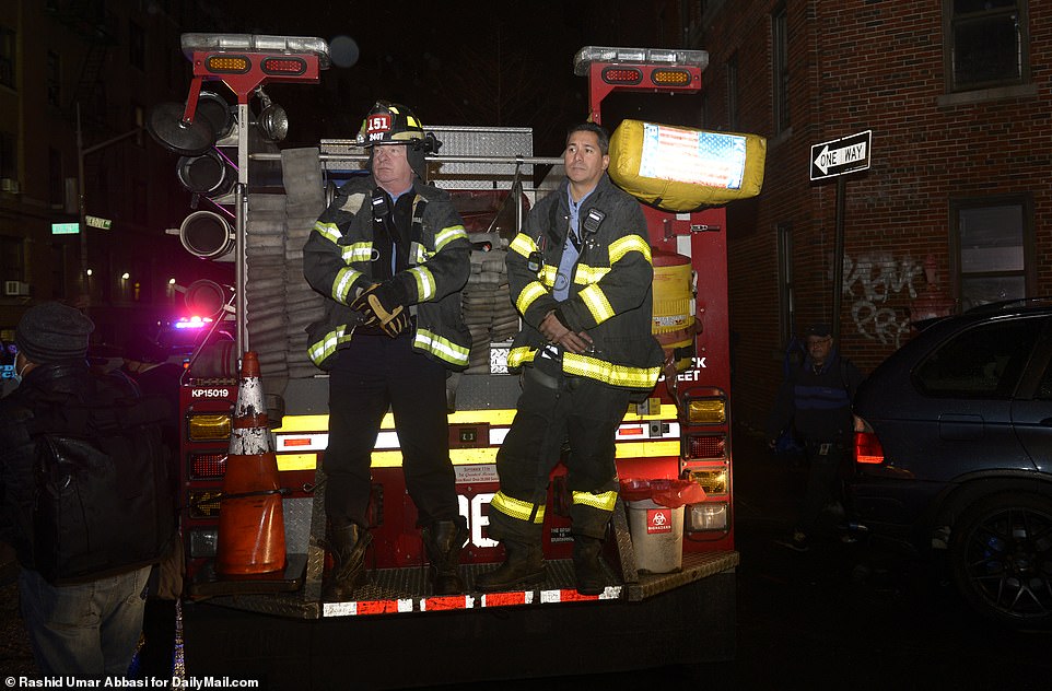 Firefighters are seen on the scene of Sunday's fire