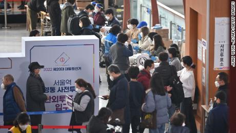 People cast their ballots during early voting South Korea's presidential election at a polling station in Seoul on March 4.