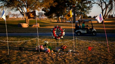 A makeshift memorial was set up at the Rockwind Community Links in Hobbs, New Mexico, Wednesday. 