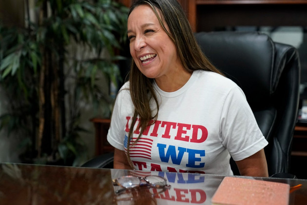 Republican Monica De La Cruz-Hernandez talks in her office.