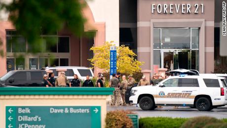 Law enforcement gather outside Columbiana Centre mall in Columbia, South Carolina, Saturday following a shooting.