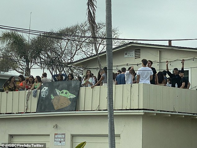 College students could be seen crowding onto rooftops and balconies in the Isla Vista area