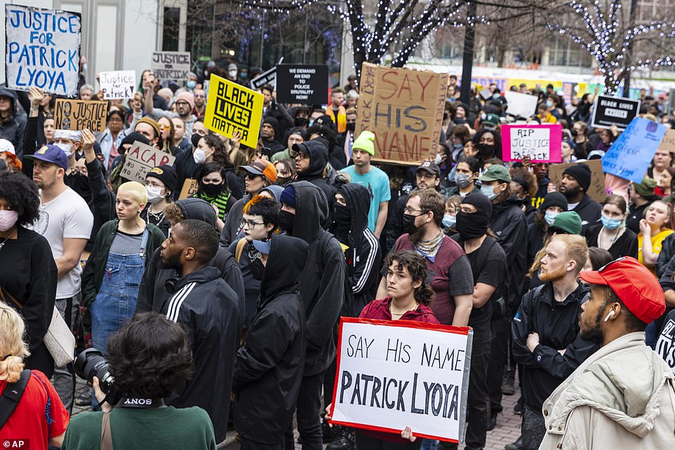Protesters march along Monroe Center NW after Grand Rapids police released video of the shooting death of Patrick Lyoya in downtown Grand Rapids, Michigan, on Wednesday