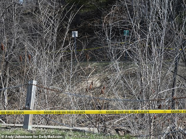 Police tape at the entrance to the wooded area where her body was discovered on Monday morning