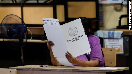 A voter casts her ballot in Manila, Philippines, on May 9.