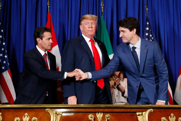 Justin Trudeau and Pena Nieto shaking hands with Donald Trump standing in between them.